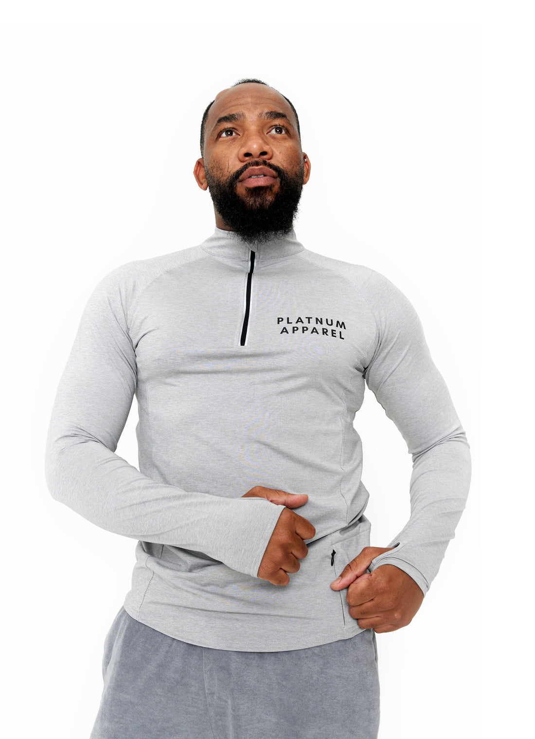 Gray long sleeve Stirrup shirt with high collar and zipper. Unisex outfit. Running clothes. Fitness outfit